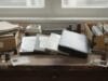 How Long Do Hard Drives and SSDs Last? How long do SSDs last? Real hard drives and solid-state drives (Seagate, Intel SSD, WD My Passport) on a desk in a home archive.